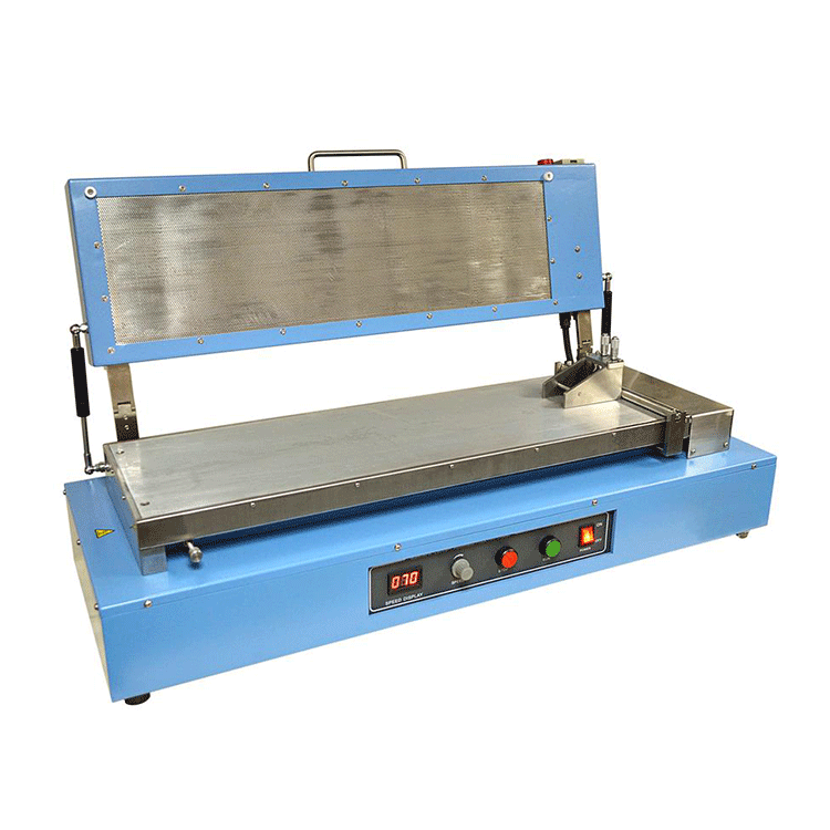 Heated vacuum doctorblade film coater